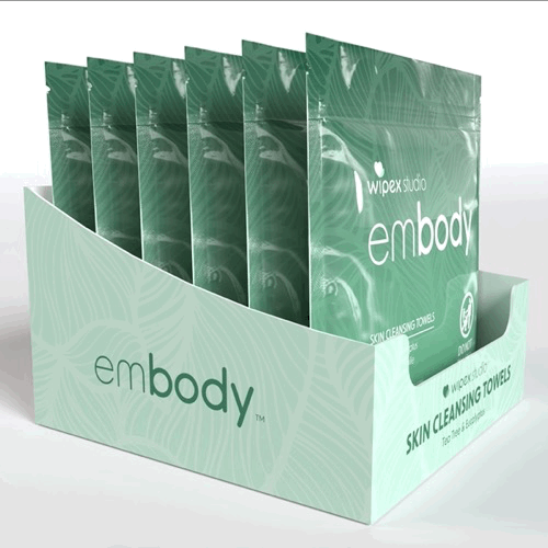Rotating 360° view of the Embody® Skin Cleansing Towels counter display box filled with 25ct pouches, tea tree and eucalyptus