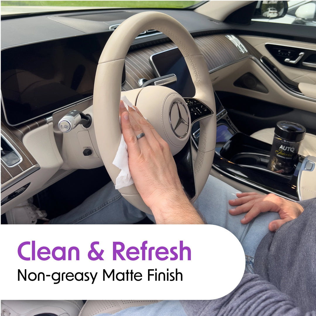 Wiping a leather steering wheel with a Wipex® auto interior wipe for a non-greasy matte finish